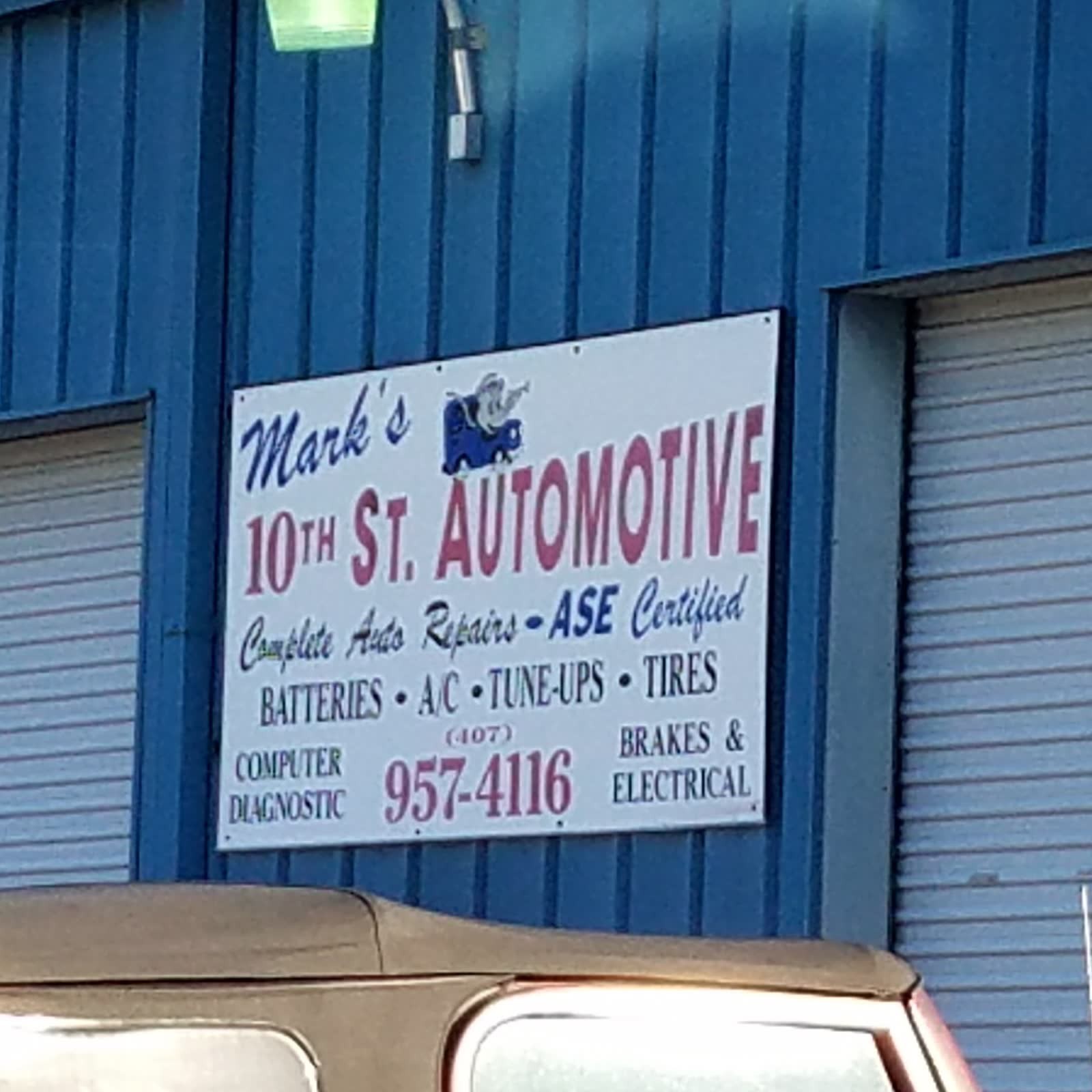 White storefront sign listing services and (407) 957-4116